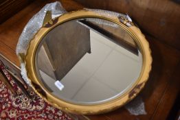 A vintage circular wall mirror , having gilt detailing, width approx. 52cm