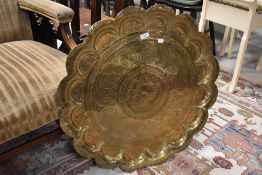 An asian style brass scalloped tray, diameter approx. 72cm