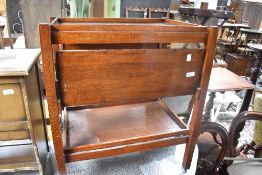 A vintage oak tea trolley with tray lift top and drop shelves (no longer folds)