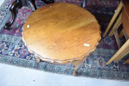 A mid 20th Century golden oak occasional coffee table, diameter approx. 61cm