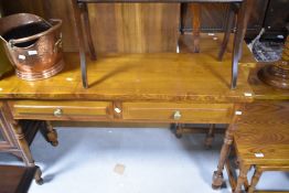 A Cryer craft elm side table having two frieze drawers, on turned legs, width approx. 122cm