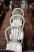 A set of three painted hoop and stick back kitchen chairs