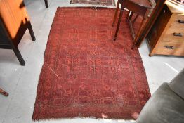A vintage Persian rug of burgundy ground, approx. 198 x 128cm