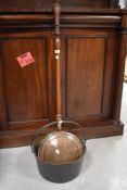 A 19th century brass preserve or jam pan with iron over handle, sold along with a copper headed