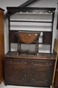 A 19th Century Jacobean style oak dresser having open delft rack, width approx. 122cm