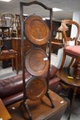 A 1920's oak folding three-tier cake stand 91.5cm