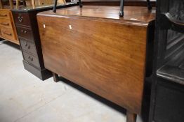 A 19th century mahogany drop-leaf dining table, with square section supports, lacking D-ends 110cm