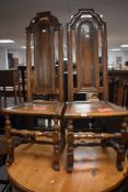 A pair of 18th/19th century tall-backed side or hall chairs, each with shaped and pierced