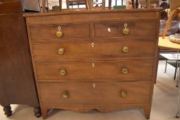 A 19th century inlaid mahogany chest of two over three graduating cockbeaded drawers, each with