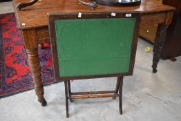 An early 20th century folding card table
