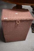 A vintage Lloyd Loom Lusty pink painted linen basket 54cm