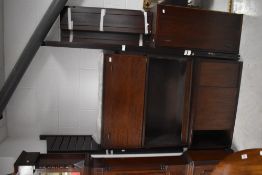 A mid century Ladderax style modular storage unit, with open, hinged and sliding door sections