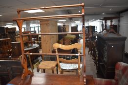 An early 20th century towel rail with pierced and shaped end supports 93cm high