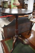 A 19th century mahogany pedestal or stem table, the circular one piece top above a turned column and