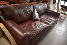 A contemporary burgundy leather 'Hide and Chic' settee, 214cm