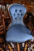 A Victorian mahogany spoon-back nursing chair, the spoon back with carved crest rail and deep-