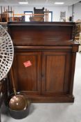 A 19th century mahogany chiffonier, of traditional design with inverted break-front top, cushion