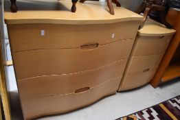 A modern serpentine fronted lightwood effect three drawer chest 79cm x 87cm, sold together with a