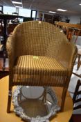 A vintage Lloyd Loom Lusty gilt painted woven wicker armchair 42cm seat height