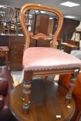 A Victorian balloon back dining chair, with later upholstered seat, set height 49cm