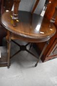 An Edwardian mahogany occasional table, of circular form with tapering square section legs 73cm