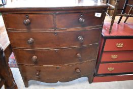 A 19th century mahogany bow-fronted chest of drawers, two over three arrangement each with turned