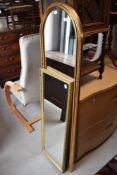 A moulded and gilt framed arched dressing mirror 140cm together with an oblong gilt framed mirror