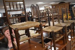 A set of four 19th century rush seated Dales type chairs, with turned spindle supports, seat