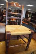A Victorian string seated dining chair, with spindled mid rail and turned supports, seat height
