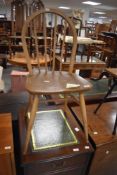 A 1960's Ercol light elm stick/hoop back chair, impressed BS JK mark to underside