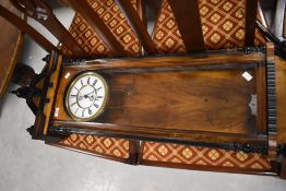 A late 19th/early 20th century walnut Vienna style wall clock, of traditional design, sold with