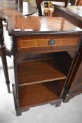 A reproduction mahogany open bookcase, of small proportions having a single frieze drawer over two