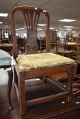 A period oak dining chair having feathered back and drop in upholstered seat, possible cut down