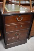 A reproduction mahogany two drawer filing cabinet, dressed as four drawers, with inset green