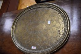 A 19th century heavy gauge Chinese brass oval platter, with moulded rim, the slightly dished