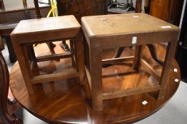 A nest of three walnut occasional tables, of rectangular form with curved supports and plain