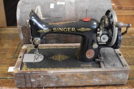 A vintage oak cased Singer sewing machine
