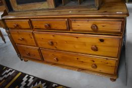 A modern pine multi-drawer chest, an arrangement of seven drawers 77cm x 138cm