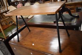 A vintage style occasional table having metal splay legs, approx. 71 x 35cm