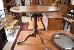 A George III mahogany 'Bird Cage' snap-top stem table, the circular one piece top over the bird cage