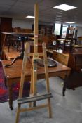 A large artists adjustable tripod easel