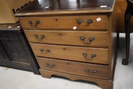A reproduction mahogany chest of four graduating drawers, in the Georgian style 76cm