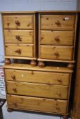 A group of modern pine bedroom furniture, comprising a three drawer chest and two bedside chests