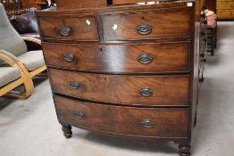 A 19th century mahogany bow-fronted chest of drawers, two over three cockbeaded drawers each with