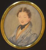 19th Century School, a portrait miniature of a young gentleman wearing a blue overcoat, set within
