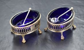 A pair of George III silver salts, of oval form having bead style rims, with decorative pierced