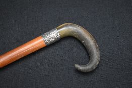 A Victorian silver mounted walking stick, the wooden cane with silver ferrule and curved horn
