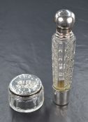 A French silver mounted cut glass scent bottle, of fluted form having a removable silver base and