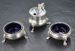 A pair of Victorian silver salts, of traditional form having bead style rims, raised on three