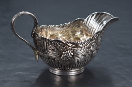 A Victorian silver sauce boat, of traditional form having shallow spout opposed by s-curve handle,